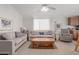 Bright living room features neutral tones, plush seating, and natural light at 5735 E Mcdowell Rd # 464, Mesa, AZ 85215