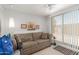 Bright living room with a comfortable sofa and sliding glass doors offering a view of the outdoors at 5735 E Mcdowell Rd # 464, Mesa, AZ 85215