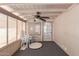 Enclosed patio with ceiling fan and door for access at 5735 E Mcdowell Rd # 464, Mesa, AZ 85215