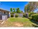 Lush backyard with green grass, shrubs, and a privacy fence, creating a serene outdoor space at 6127 N 16Th Pl, Phoenix, AZ 85016