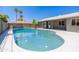 A beautiful in-ground pool set in a backyard with a grey fence at 6127 N 16Th Pl, Phoenix, AZ 85016