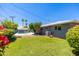 Expansive backyard with lush lawn, mature trees, and a view of the refreshing pool area at 6127 N 16Th Pl, Phoenix, AZ 85016