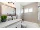 Bathroom featuring modern fixtures, a bathtub with shower, and sleek countertops at 6127 N 16Th Pl, Phoenix, AZ 85016