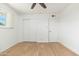 Bright bedroom featuring hardwood floors, closet, and a window with shutters at 6127 N 16Th Pl, Phoenix, AZ 85016