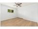 Bright bedroom featuring hardwood floors, a closet, and a window at 6127 N 16Th Pl, Phoenix, AZ 85016