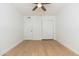 Neutral bedroom featuring hardwood floors, closet, and white walls at 6127 N 16Th Pl, Phoenix, AZ 85016