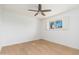 Bright bedroom featuring hardwood floors, a ceiling fan, and a window with shutters at 6127 N 16Th Pl, Phoenix, AZ 85016