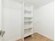 Organized walk-in closet featuring built-in shelving and ample storage space at 6127 N 16Th Pl, Phoenix, AZ 85016