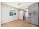 Bright dining area with large window, sliding barn door, and gray built in cabinets at 6127 N 16Th Pl, Phoenix, AZ 85016