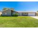 Charming single story home with a well maintained front yard, two car garage, and interesting privacy screen at 6127 N 16Th Pl, Phoenix, AZ 85016