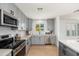Bright kitchen features stainless steel appliances, subway tile backsplash, and gray cabinetry at 6127 N 16Th Pl, Phoenix, AZ 85016