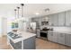 Spacious kitchen featuring a large island with pendant lighting and modern appliances at 6127 N 16Th Pl, Phoenix, AZ 85016