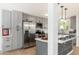 Bright kitchen with stainless steel appliances, gray cabinets, and quartz countertops at 6127 N 16Th Pl, Phoenix, AZ 85016
