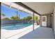 Covered patio overlooking a refreshing pool and lush landscaping for outdoor enjoyment at 6127 N 16Th Pl, Phoenix, AZ 85016