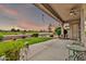 Relax on the covered patio with serene golf course views, perfect for unwinding and enjoying the scenery at 6141 S Bradshaw Way, Chandler, AZ 85249