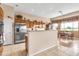 Bright kitchen with stainless steel appliances, offering a seamless flow to the adjacent dining area at 6141 S Bradshaw Way, Chandler, AZ 85249