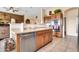 Well-equipped kitchen with stainless steel appliances and warm wood cabinets offering both style and functionality at 6141 S Bradshaw Way, Chandler, AZ 85249