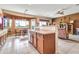 Open-concept kitchen featuring a breakfast nook and views into the adjacent living room, perfect for entertaining at 6141 S Bradshaw Way, Chandler, AZ 85249