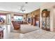 Spacious living room filled with natural light boasts a ceiling fan and comfortable furniture at 6141 S Bradshaw Way, Chandler, AZ 85249