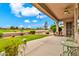 Enjoy the outdoors on this patio with vibrant green grass and golf course views at 6141 S Bradshaw Way, Chandler, AZ 85249