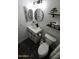 This bathroom features a modern vanity with dark hardware and a framed round mirror at 711 W El Alba Way, Chandler, AZ 85225
