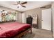 Bedroom features natural light, ceiling fan, a decorative plant shelf, and ample space at 711 W El Alba Way, Chandler, AZ 85225