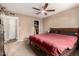 This bedroom boasts a ceiling fan, a closet, and ample natural light creating a tranquil retreat at 711 W El Alba Way, Chandler, AZ 85225