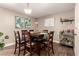 Dining room features a wooden table, seating for six, and stylish decor at 711 W El Alba Way, Chandler, AZ 85225