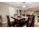 Inviting dining area with a modern light fixture and easy access to the kitchen at 711 W El Alba Way, Chandler, AZ 85225