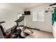 Exercise room features workout bike, weight bench and mirror creating a great space for your daily routine at 711 W El Alba Way, Chandler, AZ 85225