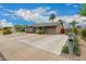 Lovely home with a spacious driveway, well-kept landscaping, and inviting curb appeal at 711 W El Alba Way, Chandler, AZ 85225