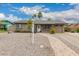 Charming single-story home featuring a stone walkway and desert landscaping at 711 W El Alba Way, Chandler, AZ 85225