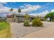 View of home's desert landscaping and well-maintained exterior on a sunny day at 711 W El Alba Way, Chandler, AZ 85225