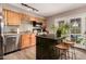 Well-equipped kitchen with stainless steel appliances, wood cabinets and granite island at 711 W El Alba Way, Chandler, AZ 85225