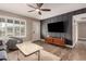 Bright living room featuring modern furniture, wood floors, and natural light at 711 W El Alba Way, Chandler, AZ 85225