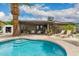 Backyard pool with steps, a covered patio, and lounge seating at 711 W El Alba Way, Chandler, AZ 85225