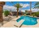 Backyard pool with diving board and a covered patio at 711 W El Alba Way, Chandler, AZ 85225