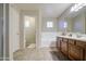 Bright bathroom featuring dual sinks, a soaking tub, and updated fixtures at 7242 S 48Th Gln, Laveen, AZ 85339