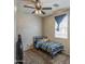 Bright bedroom featuring a ceiling fan, carpet floors and natural light at 7242 S 48Th Gln, Laveen, AZ 85339