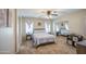 Well-lit main bedroom offering a comfortable bed and ample closet space with mirrored doors at 7242 S 48Th Gln, Laveen, AZ 85339