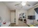 Shared bedroom with twin bed, crib, dresser and a mirrored closet, providing functional living at 7242 S 48Th Gln, Laveen, AZ 85339