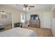Comfortable bedroom featuring a ceiling fan, dresser and modern decor at 7242 S 48Th Gln, Laveen, AZ 85339