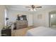 Comfortable bedroom featuring a ceiling fan, dresser and modern decor at 7242 S 48Th Gln, Laveen, AZ 85339
