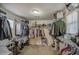 Spacious walk-in closet with ample shelving, rods, and organization space at 7242 S 48Th Gln, Laveen, AZ 85339