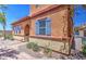 Charming home exterior with desert landscaping and blue shutters at 7242 S 48Th Gln, Laveen, AZ 85339