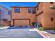 The home features a two-car garage and modern AC units, complemented by desert landscaping at 7242 S 48Th Gln, Laveen, AZ 85339