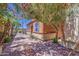 Charming home exterior with desert landscaping and blue shutters at 7242 S 48Th Gln, Laveen, AZ 85339