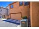 The home features a two-car garage and modern AC units, complemented by desert landscaping at 7242 S 48Th Gln, Laveen, AZ 85339
