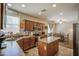 Well-equipped kitchen features stainless steel appliances, a center island, and ample counter space at 7242 S 48Th Gln, Laveen, AZ 85339