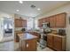 Bright kitchen featuring stainless steel appliances, ample cabinet space, and a functional center island at 7242 S 48Th Gln, Laveen, AZ 85339